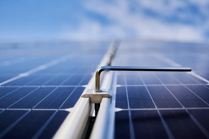 A solar panel with a metal rod attached to it.