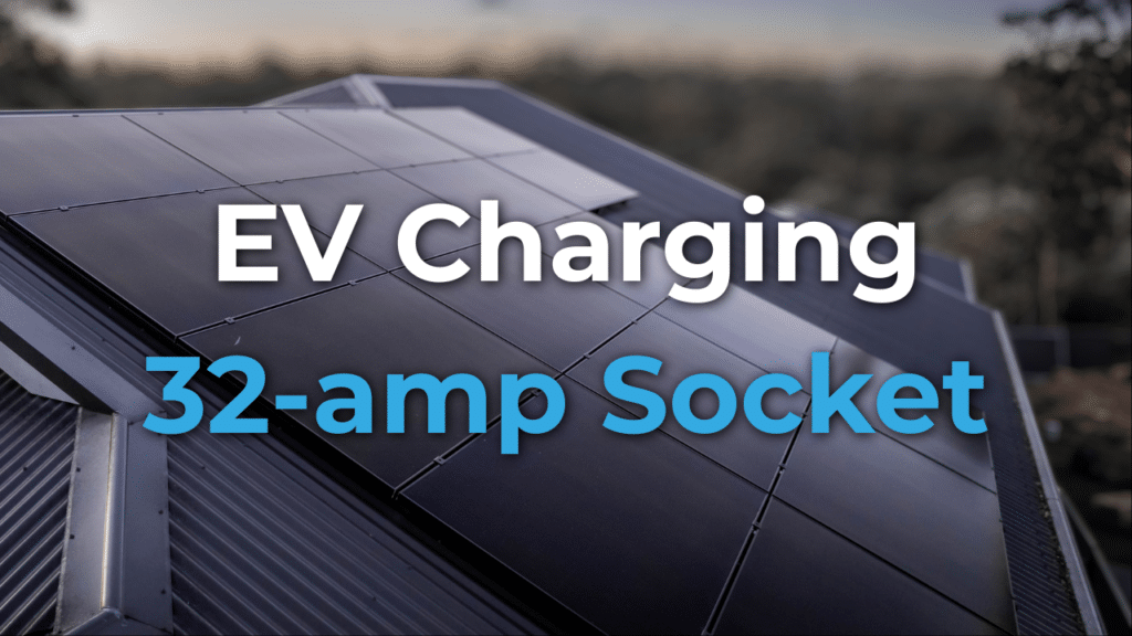 Rooftop solar panels with text overlay reading "EV Charging 32-amp Socket.
