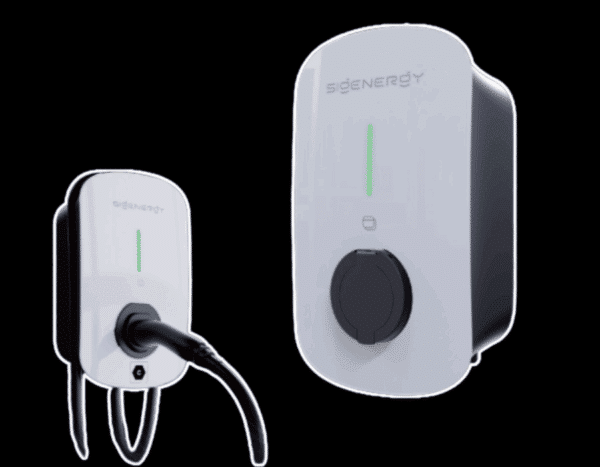 Two white electric vehicle charging stations with black accents, one with a charging cable attached and the other without, both displaying a green status indicator.