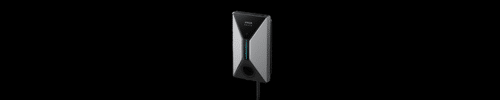 A wall-mounted electric vehicle charging station with a black and silver design and a cord hanging from the bottom.