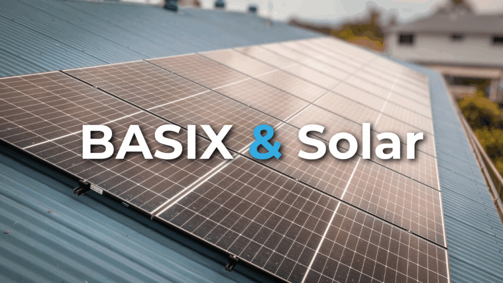 Rows of solar panels installed on a blue metal roof with the text "BASIX & Solar" overlayed in large font.