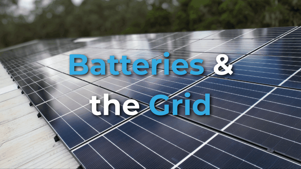 Close-up of solar panels installed outdoors with the words "Batteries & the Grid" in large blue and white text across the image.