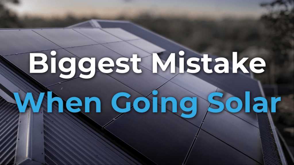 Close-up of a rooftop with solar panels installed, overlaid with the text "Biggest Mistake When Going Solar.