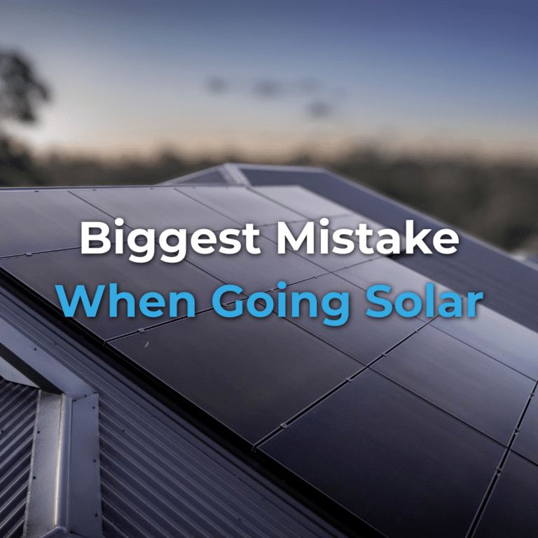 Close-up of solar panels on a rooftop at dusk with the text “Biggest Mistake When Going Solar” overlaid on the image.