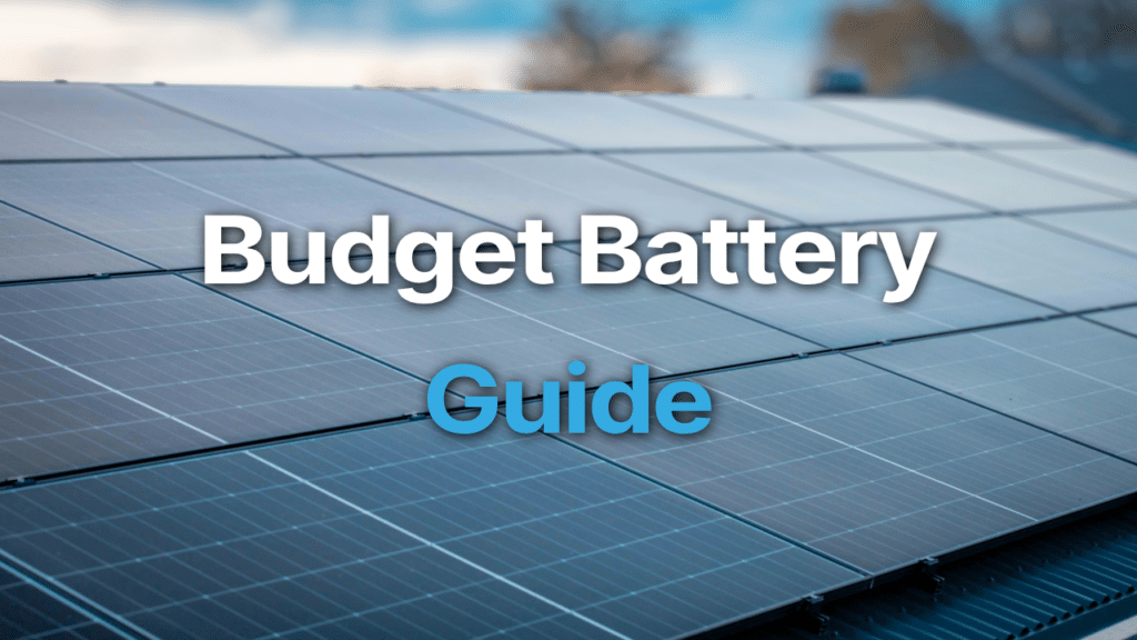 Close-up of solar panels on a roof with blurred background; text overlay reads "Budget Battery Guide.