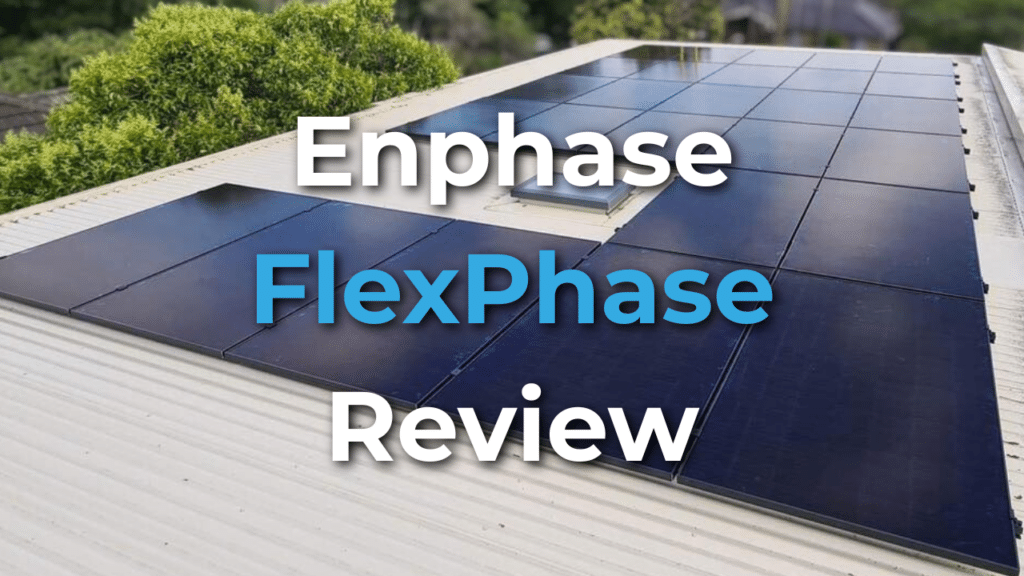 Rows of black solar panels installed on a white metal roof, with the text "Enphase FlexPhase Review" overlaid in large font.