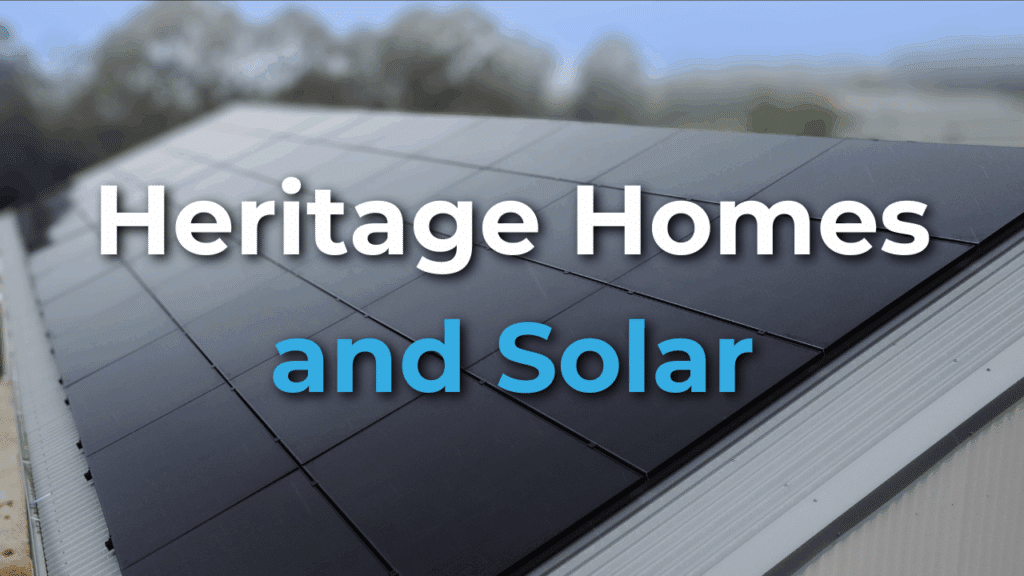 A close-up of a sloped roof covered with solar panels, with the text "Heritage Homes and Solar" overlaid on the image.