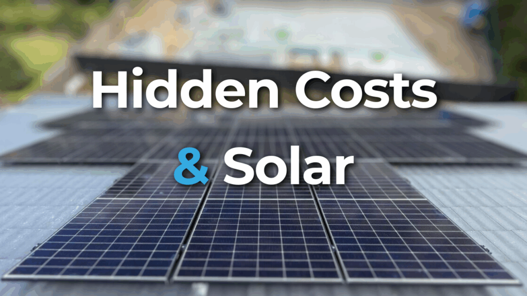 Rows of solar panels installed on a roof with the text "Hidden Costs & Solar" overlaid in large font.
