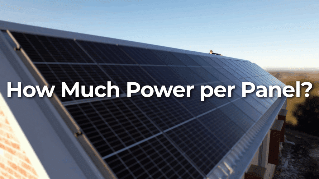 Rooftop solar panels with text overlay reading "How Much Power per Panel?" against a clear sky background.