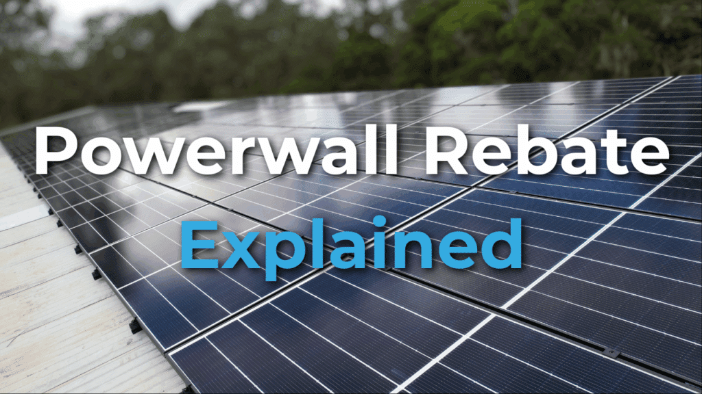 Rows of solar panels on a roof with the text "Powerwall Rebate Explained" overlaid on the image. Trees are visible in the blurred background.