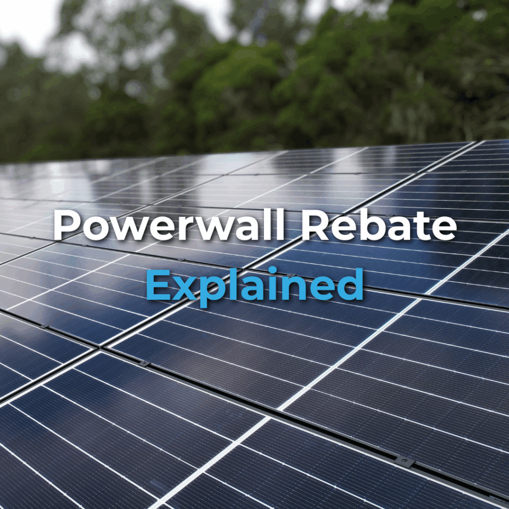 Close-up of solar panels outdoors with trees in the background. Text overlay reads, "Powerwall Rebate Explained.