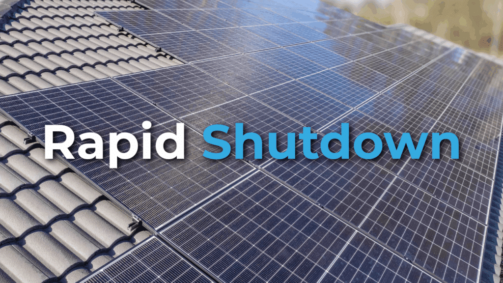 Rows of solar panels installed on a tiled roof with the words "Rapid Shutdown" overlaid on the image.