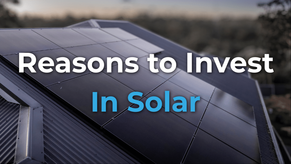 Rooftop solar panels with the text “Reasons to Invest In Solar” overlaying the image.