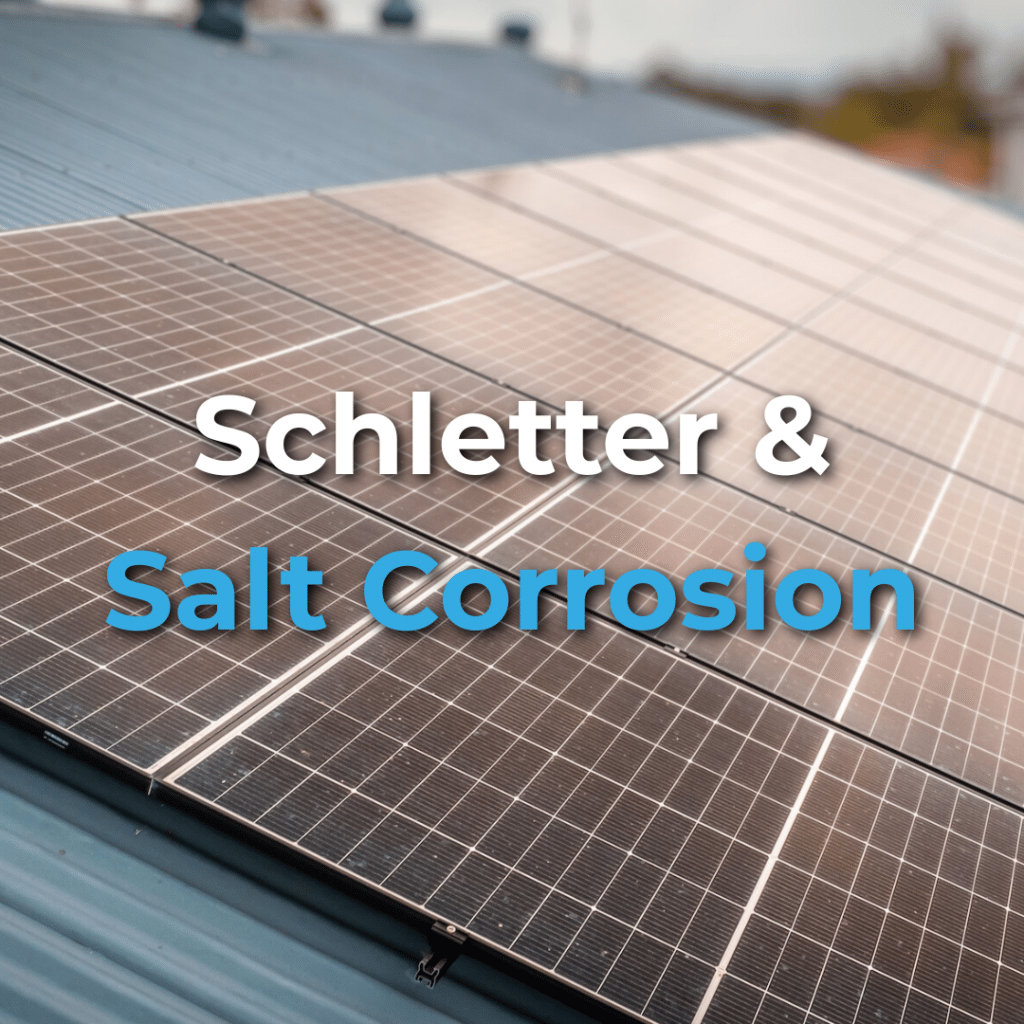 Close-up of solar panels mounted on a metal roof with the text "Schletter & Salt Corrosion" overlaid in white and blue letters.