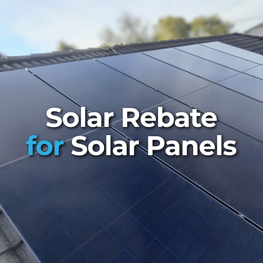 Close-up of solar panels on a roof with the text "Solar Rebate for Solar Panels" overlaid in the center.