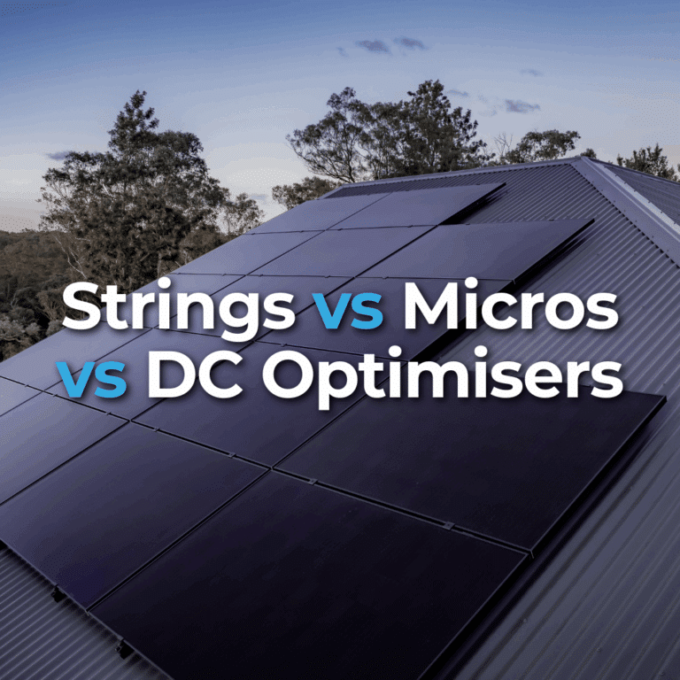 Solar panels installed on a sloped metal roof, with the text "Strings vs Micros vs DC Optimisers" overlaid on the image. Trees and sky visible in the background.
