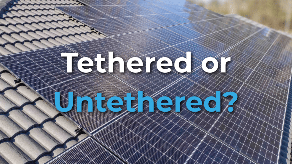 Close-up of solar panels installed on a tiled roof with the words "Tethered or Untethered?" displayed over the image.