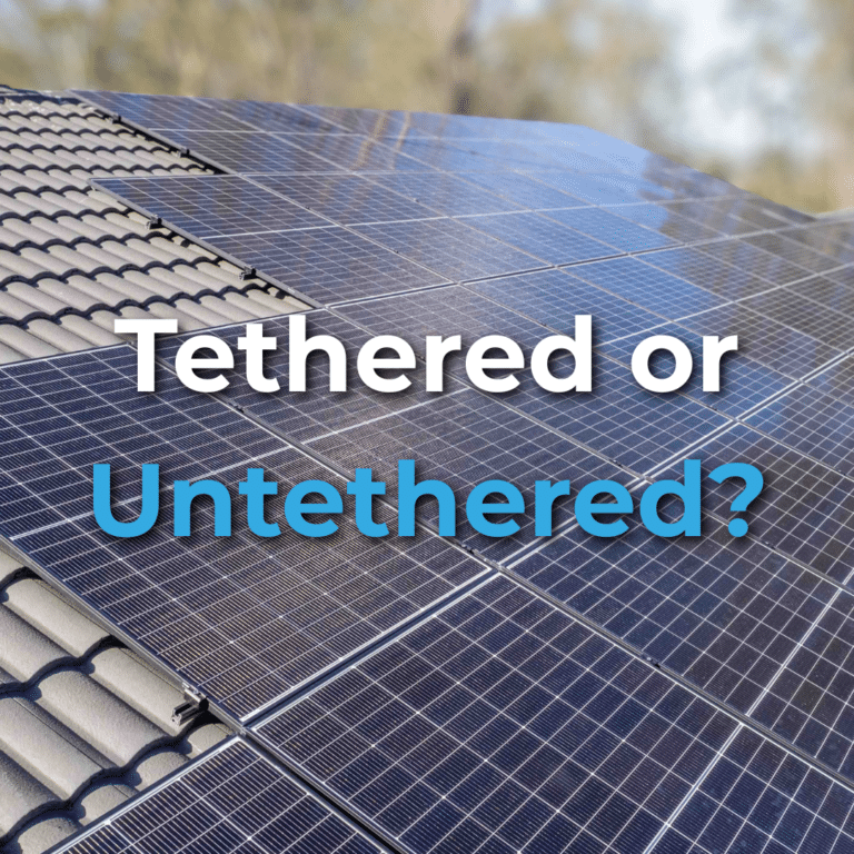 Close-up of solar panels installed on a tiled roof with the words "Tethered or Untethered?" overlaid on the image.